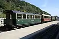 Ehemalige Schweizer Reisezugwagen, vorn B 61 (Bj. 1910) der Appenzeller Bahn, dahinter C 42 (vormals MOB)