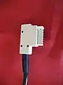 Ein „ADoS 16“ (TAE 16)-Stecker