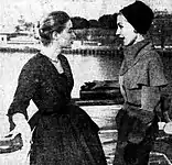 Das amerikanische Model Barbara Phillips (links) mit Martelli bei einer Modenschau auf der M.V. Sydney, 1953.