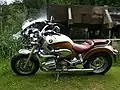 Customized BMW R 1200 C Cruiser Independent in front of watermill