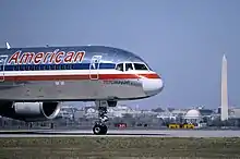A Boeing 757, registration N64AAA, at Ronald Reagan Washington National Airport in March 1995