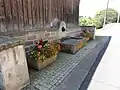 Einer der Dorfbrunnen