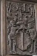 Holztäfelung mit Wildem Mann und Wilder Frau als Schildhalter
