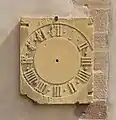 Steinernes Zifferblatt einer Turmuhr, Colmar