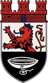 Ein Weberschiffchen mit abhängendem silbernen Faden (Hückeswagen DE)