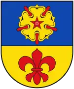 Wappen von Kevelaer: goldene Rose mit fünfzackigem Butzen und roten Kelchblättern