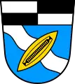 Ein schräg links gestelltes goldenes Weberschiffchen (Tuchenbach DE)