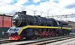 DLM BR 52 8055 umfährt ihren Zug in  Winterthur, im Hintergrund das provisorische Dampfzentrum Winterthur