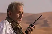Dirk van den Berg filming in the Saudi Arabian desert.