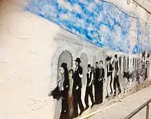 Graffiti im Stadtzentrum von Orestiada zum Thema Vertreibung