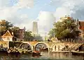 Holländische Stadt mit Ruderbooten bei einer Brücke