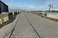 Reste der Gleise der ehemaligen Tralee-Fenit-Eisenbahn auf der Brücke zum Hafen Fenit