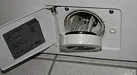 Flusensieb an der Vorderseite einer Waschmaschine
