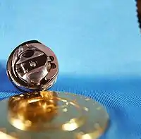 Fig. 14a. Ringgreifer mit Spulengehäuse einer modernen Nähmaschine