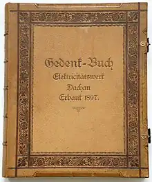 Titelseite Gedenkbuch Elektrizitätswerk Dachau (heute Günding) anlässlich der Feierlichkeiten zur Inbetriebnahme am 4. Dezember 1897