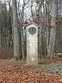 Gedenkstein (1919), Das weisse Kreuz im roten Feld. Für Friedrich Oser (1820–1891) Pfarrer und Dichter, in Biel-Benken, Kanton Basel-Landschaft. Koordinaten 47°30'43.9"N 7°31'16.8"E