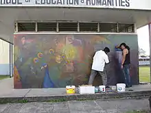 George Simon und Anil Roberts bei der Arbeit an dem Wandbild Palace of the Peacock an der Universität Guyana 2009.