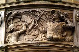Das „hannoversche Papageienschießen“ mit der Armbrust als Teil mittelalterlicher Schützenfeste; Geschichtsfries am Neuen Rathaus in Hannover