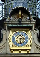 Uhr und Hahn