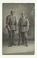 Reservisten vor dem Ausmarsch 1914 in grauer Felduniform mit Helm