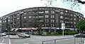 Wohnblock mit Läden Maria-Louisen-Str. 63–67, die sogenannten Burmeisterhäuser