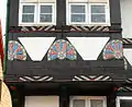 Fächerrosetten am Erker