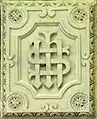 Verschlungenes IHS in Saint-Martin de L’Isle-Adam