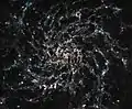 Infrarotaufnahme mithilfe des James Webb-Weltraumteleskops. Die Staubverteilung in der Galaxie wird deutlich.
