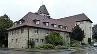 Johanneskirche mit Gemeindehaus, mittlerweile ist dieses nicht mehr vorhanden. Es wurde aufgrund einer Modernisierung der Kirche und Baumängeln abgerissen. Die Johanneskirche, „Neue Mitte“ strahlt in neuem Glanz.