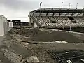 Für den Bau vorbereitete Fläche einer der südlichen Hintertortribünen im März 2021