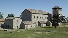 Fotorealistische Rekonstruktion der um 780 errichteten Pfalzkapelle als Vorgängerbau zur Zeit der Karolinger