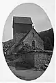 Ansicht von Nordwesten im Jahr 1926, noch mit alter Turmgestalt (Satteldach) und alter Eisenbahn-Gitterbrücke