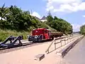 Köf II mit Flachgüterwagen als Denkmal in Pronsfeld