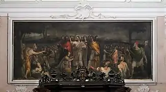 Wundersame Brotvermehrung von Lorenzo Costa über dem Haupteingang