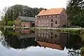 Die Buschmühle mit Weiher am Mühlenbach