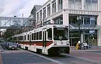 MAX train on Yamhill St with Pioneer Place (1991) – Portland, Oregon