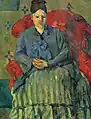 Paul Cezanne: Mme Cézanne in rotem Lehnstuhl, 1877