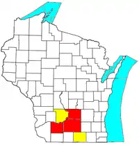 Die Metropolregion Madison (rot) mit Erweiterung zur Madison-Janesville-Beloit Combined Statistical Area (gelb)