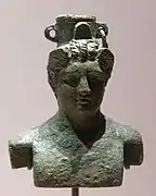 Kleines Bronzegefäß (Unguentarium) in Form einer Büste des Hermes, als Gewichtsstück wiederverwendet