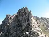 Felskopf mit Eisenklammern beim Übergang vom Dritten zum Zweiten Schafalpenkopf