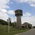 Dorfeingang und Wasserturm