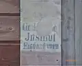 Inschrift am ehemaligen nördlichen Nebeneingang (2022)