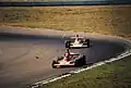 Lauda im Ferrari vor Fittipaldis M23B; Watkins Glen, 1974