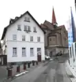 Schaumühle Scheerer-Müh­le, im Hintergrund St. Peter und Paul