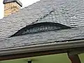 Feldermausgaube in einer Schieferdeckung