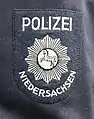 Ärmelabzeichen der alten blau/grauen Uniform bis 1976