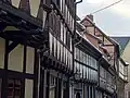Knaggenreihe an Häusern der Gasse „Stieg“ in Quedlinburg