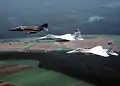 RF-4E mit F-15As in Kettenformation