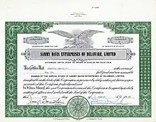 Gründeraktie Nr. 1 der Sammy Davis Enterprises of Delaware, Ltd. über 6 Anteile zu je 100 $, ausgegeben am 25. März 1965, eingetragen auf Sammy Davis Jr. und mit seiner eigenhändigen Unterschrift als Präsident. Das Aktienkapital seiner Produktionsfirma bestand aus 10.000 $.