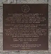 Schild an der Severinstorburg mit der Sage des Jan von Werth